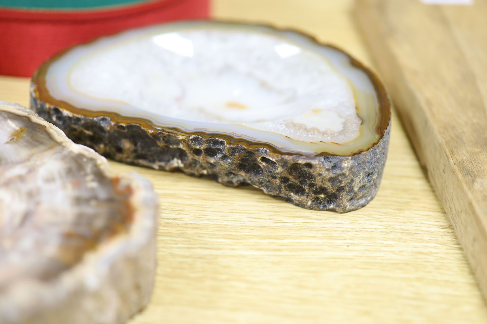 An amethyst geode section and assorted mineral specimens